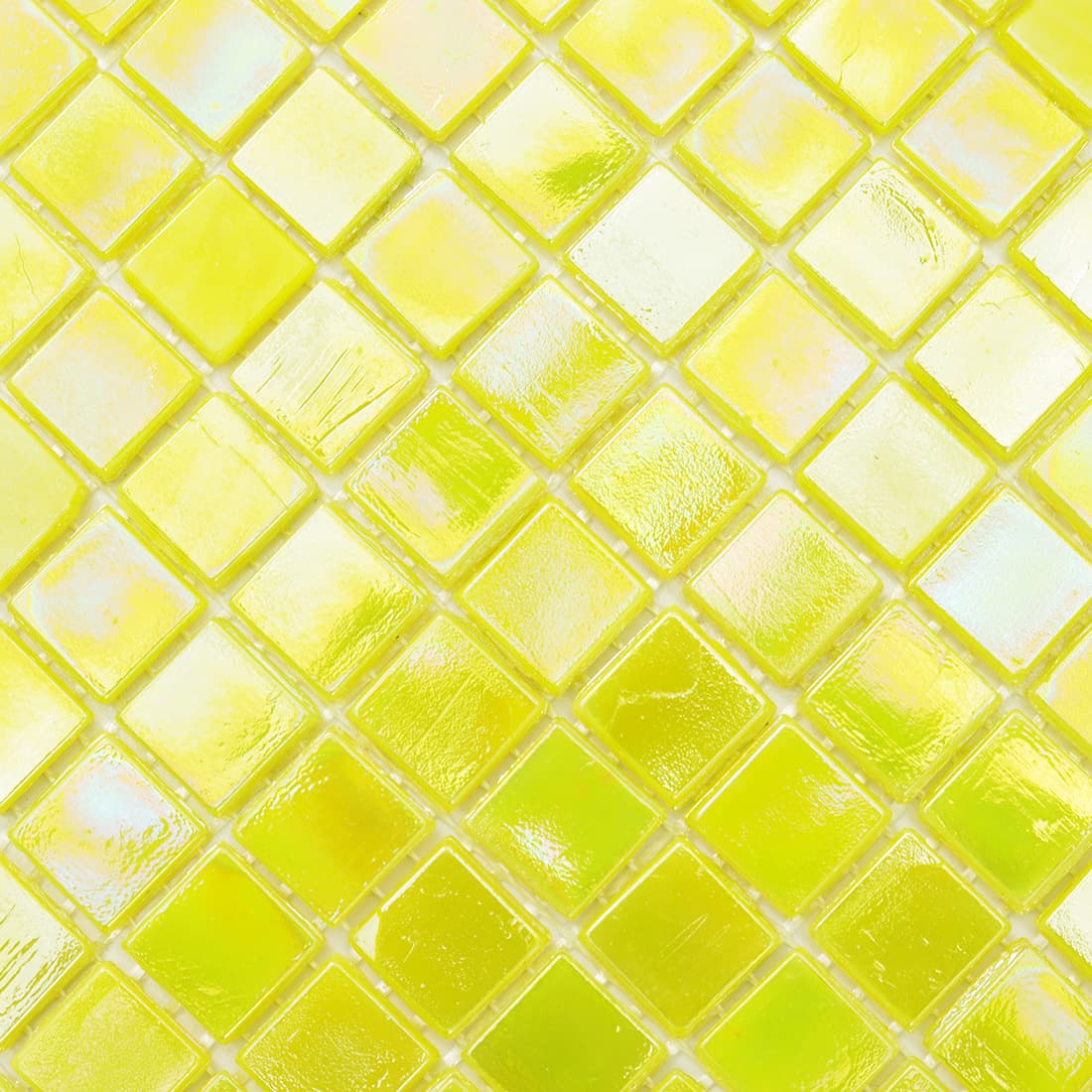 Macro shot of pearlescent lime yellow glass mosaic tiles showing rainbow reflective 
