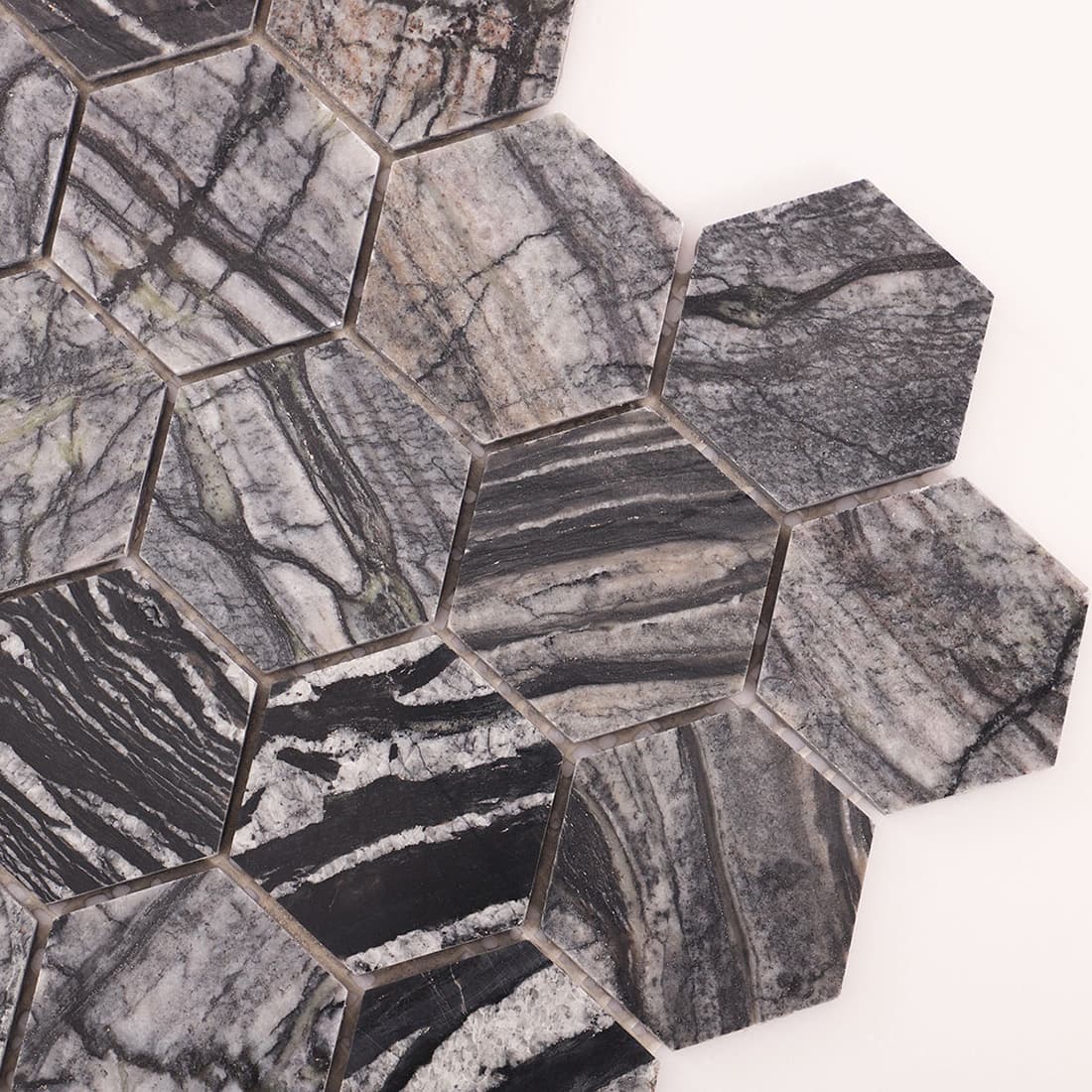Angled corner view of grey marble hexagon mosaic tiles.