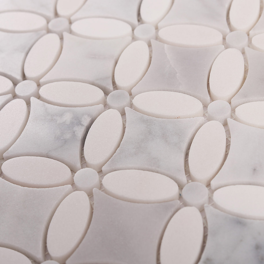 Close up of marble oval flower mosaic showing stone texture and joints