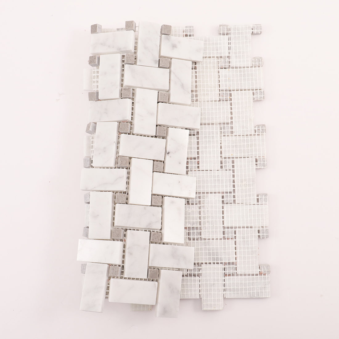 Back view of marble basketweave mosaic sheet showing mesh backing