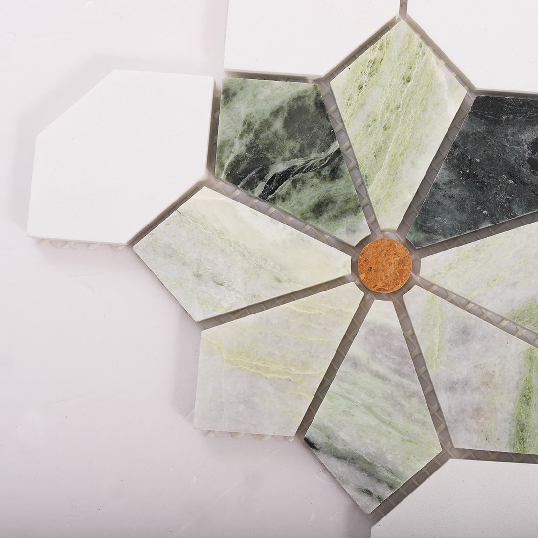 Close up of a single flower motif in green marble mosaic tile