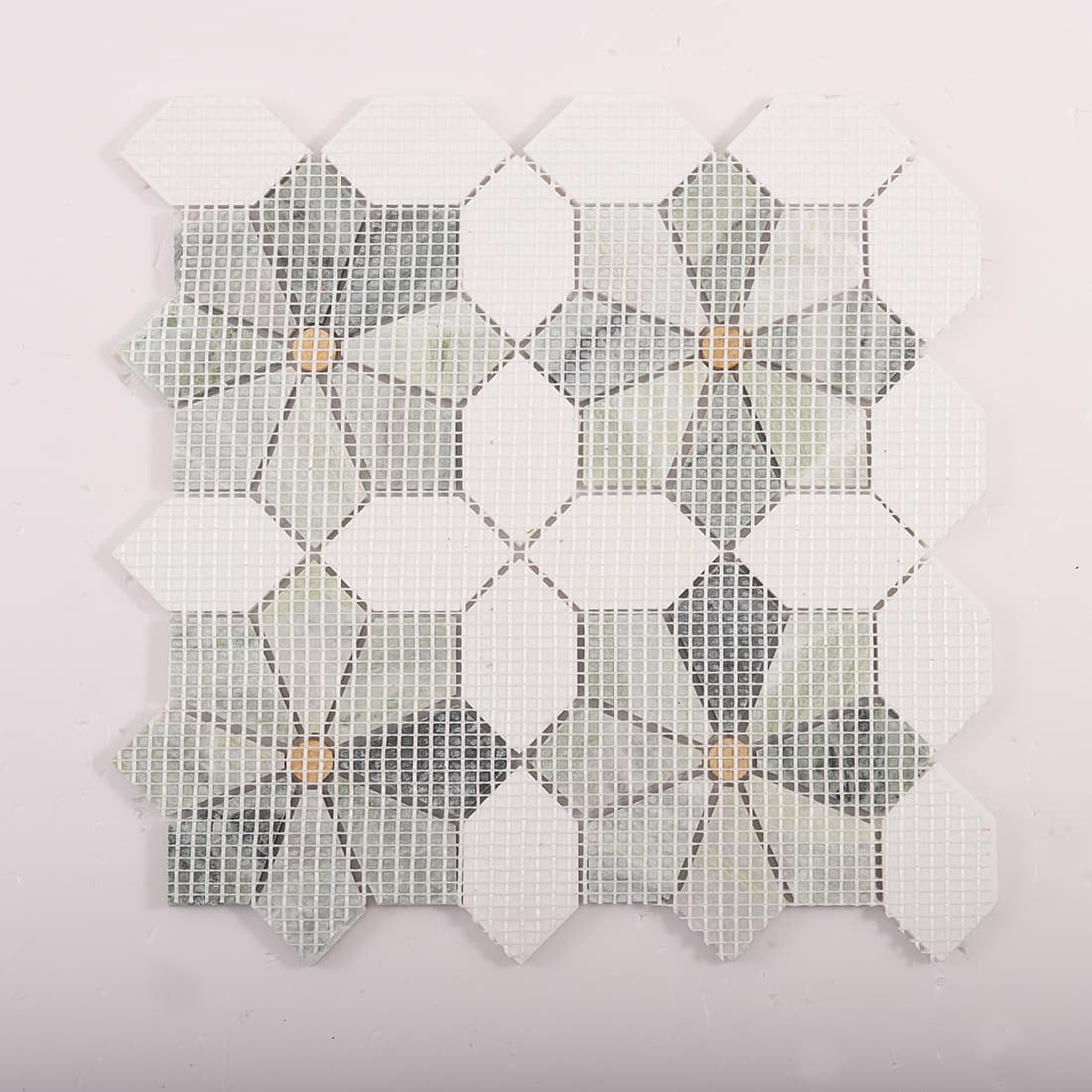Back view of flower marble mosaic sheet on mesh backing