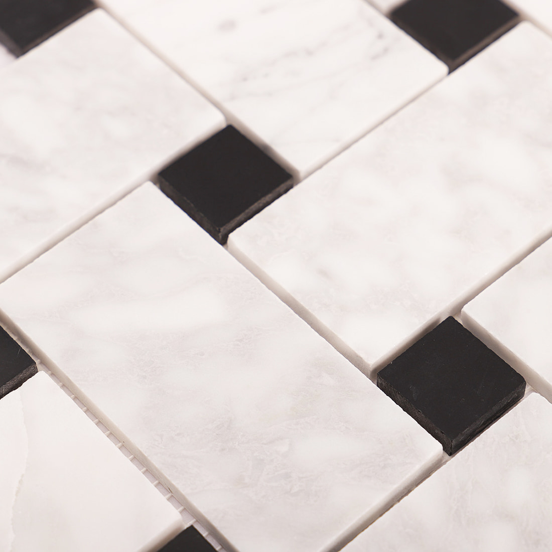 Close-up of the interlocking marble mosaic pattern with black square accents.