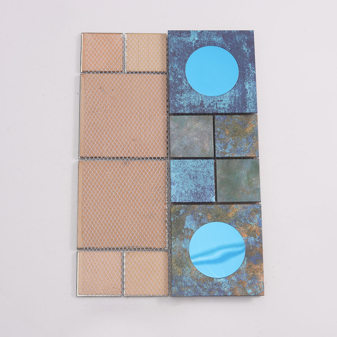 Mesh back view of dark blue aluminum mosaic tile with round blue mirror inserts