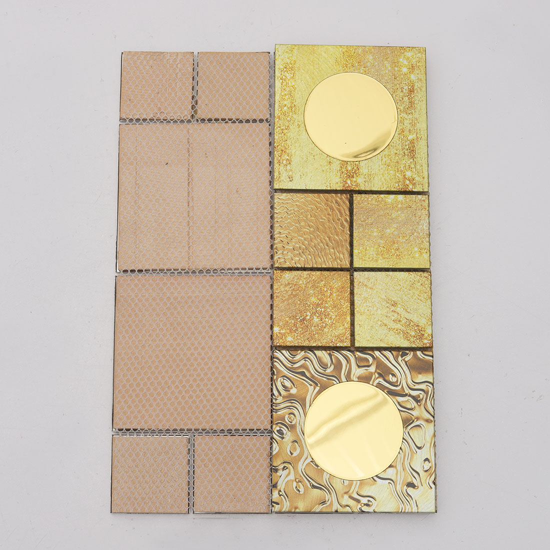 Mesh back view of gold textured aluminum mosaic tile with round mirror inserts