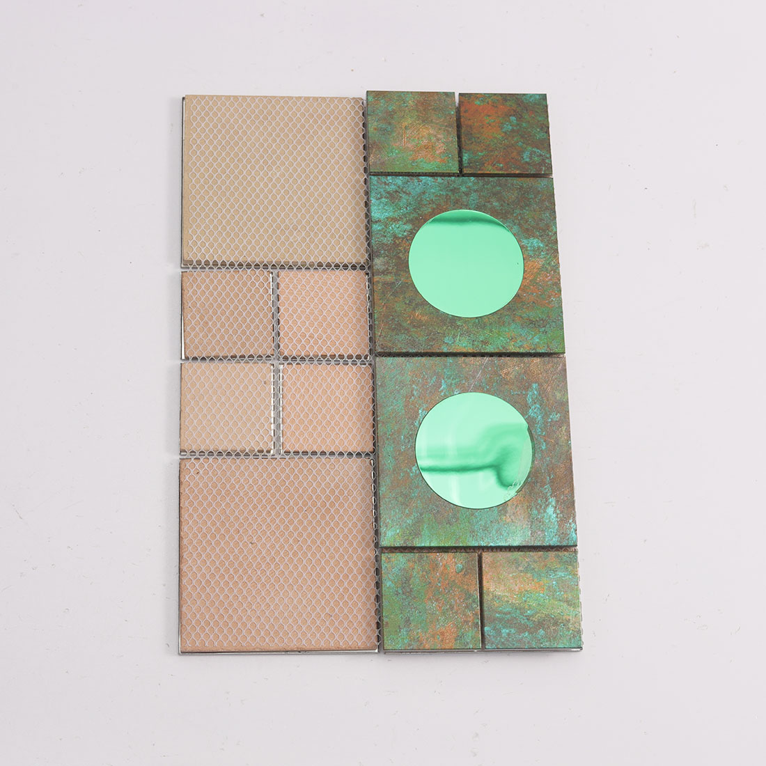 Mesh back view of verdigris green aluminum mosaic tile with round mirror inserts