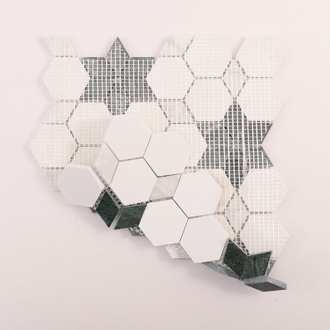 Back view of mesh-backed sheet with white hexagons and green star inlays.
