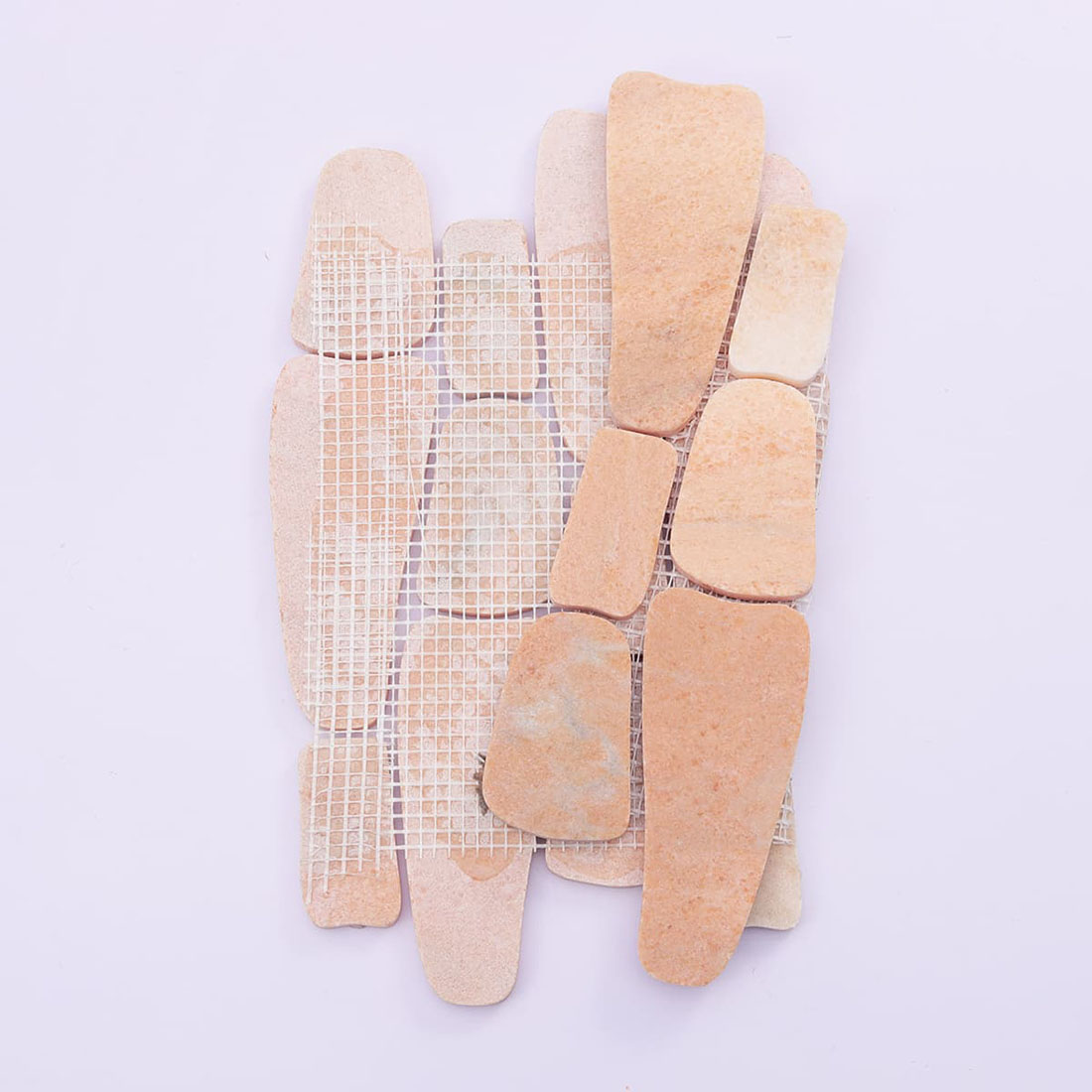 Back view of mesh-mounted peach stone irregular mosaic tile sheet