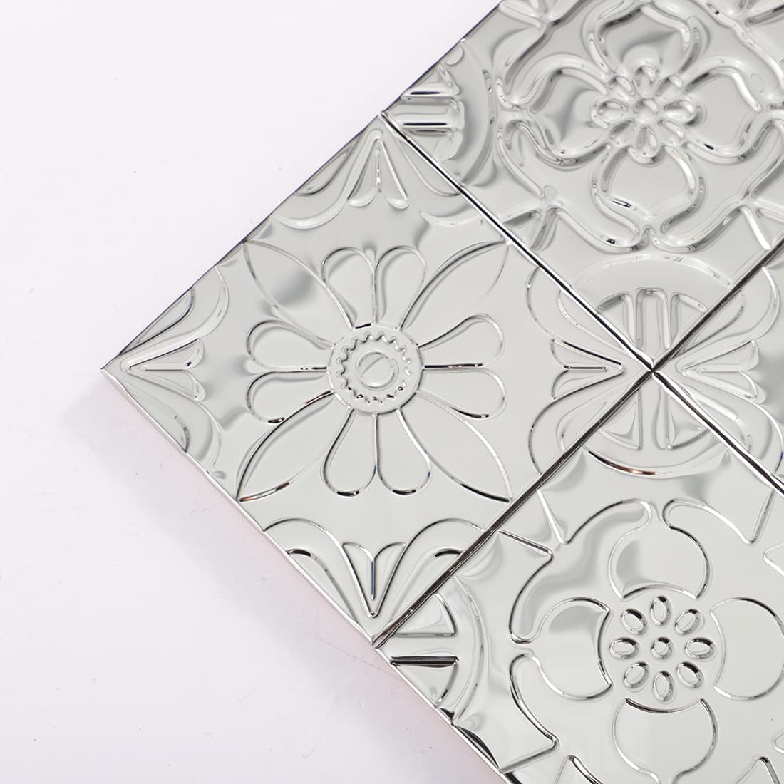 Mirror silver floral embossed mosaic tile corner close-up shot