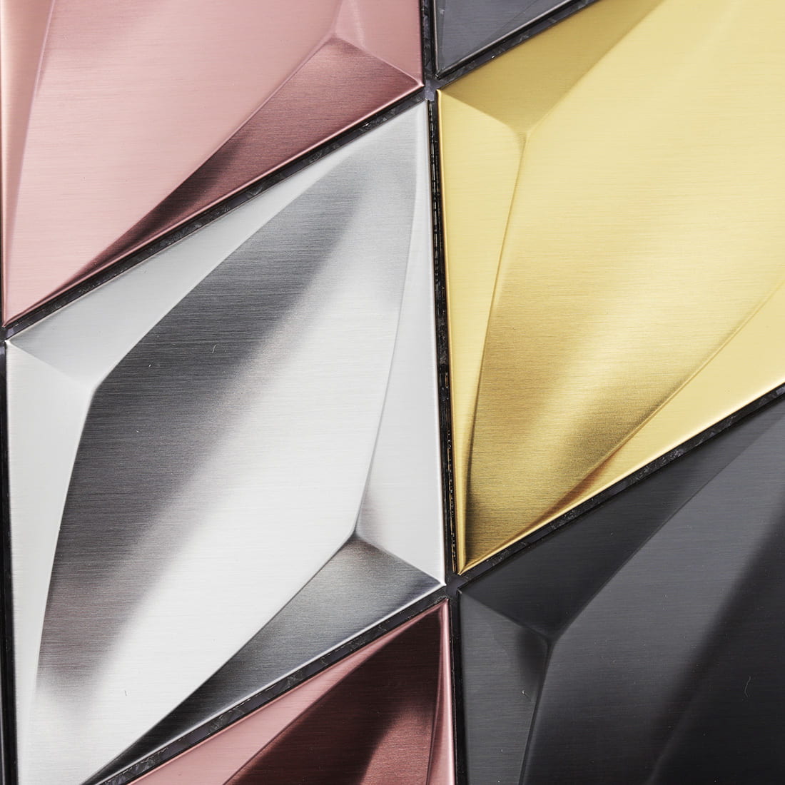 Close-up of mixed color diamond metal mosaic with brushed surfaces