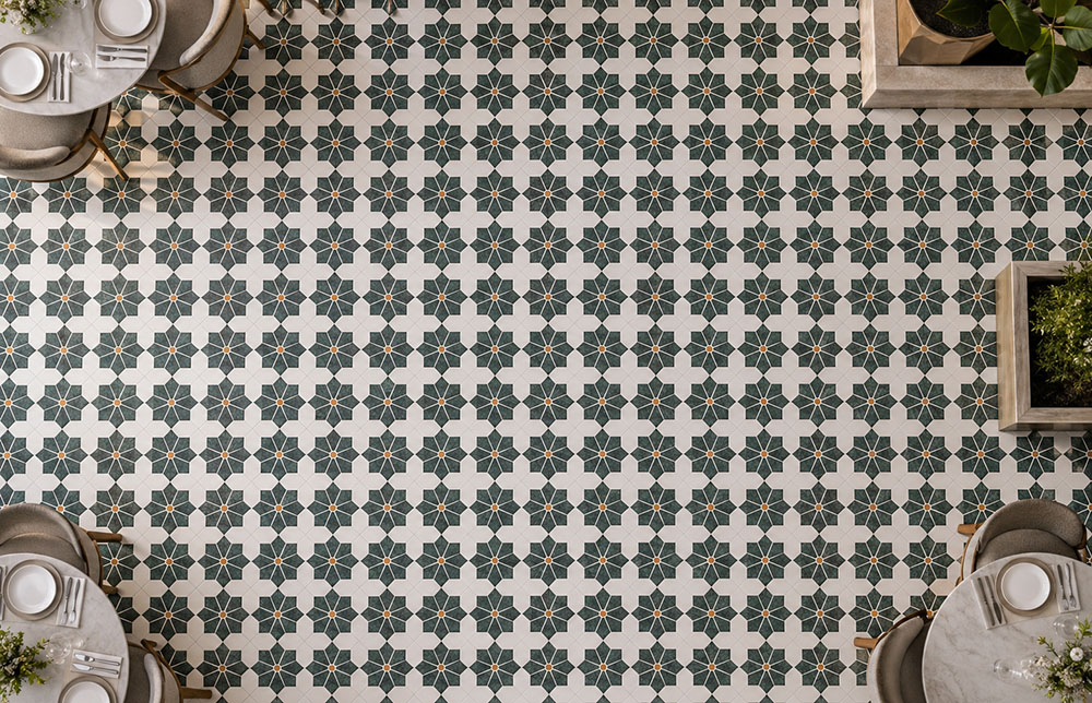 Modern geometric floor tiles with green and white stone patterns in a stylish restaurant