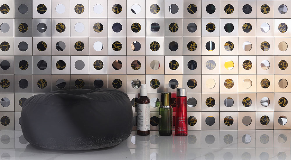 {"default":"Modern silver square metal mosaic wall with black gold circular inserts"}
