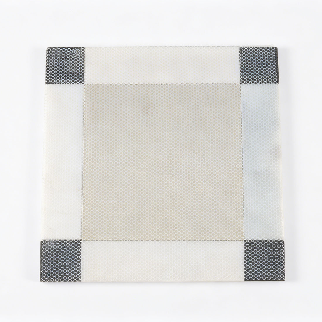 Beige marble border tile with white mosaic surface and black mosaic corner accents