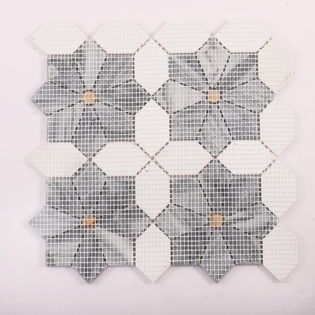 Back view of mosaic tile sheet showing mesh backing and layout