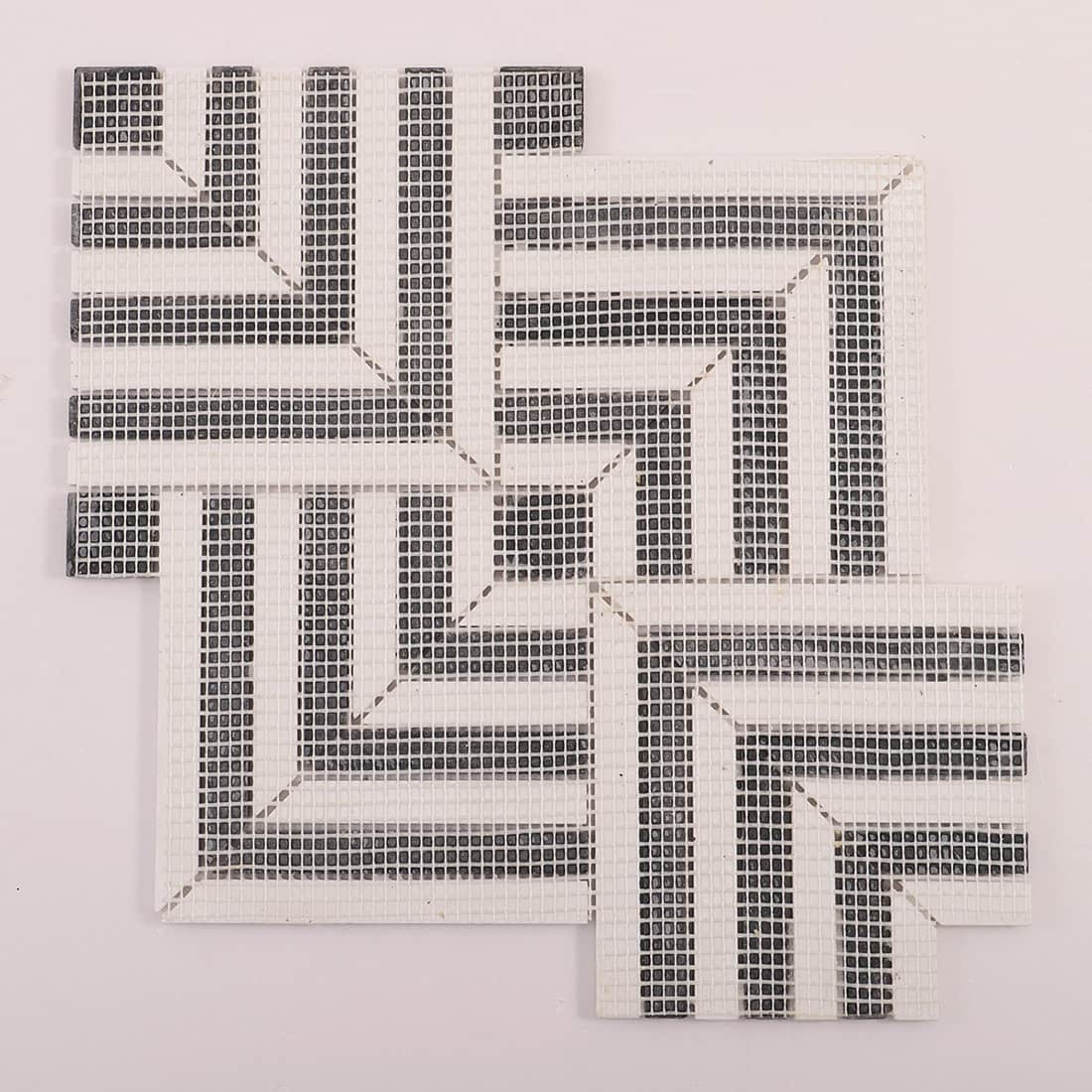 Black and white chevron mosaic mounted on mesh backing, full sheet view