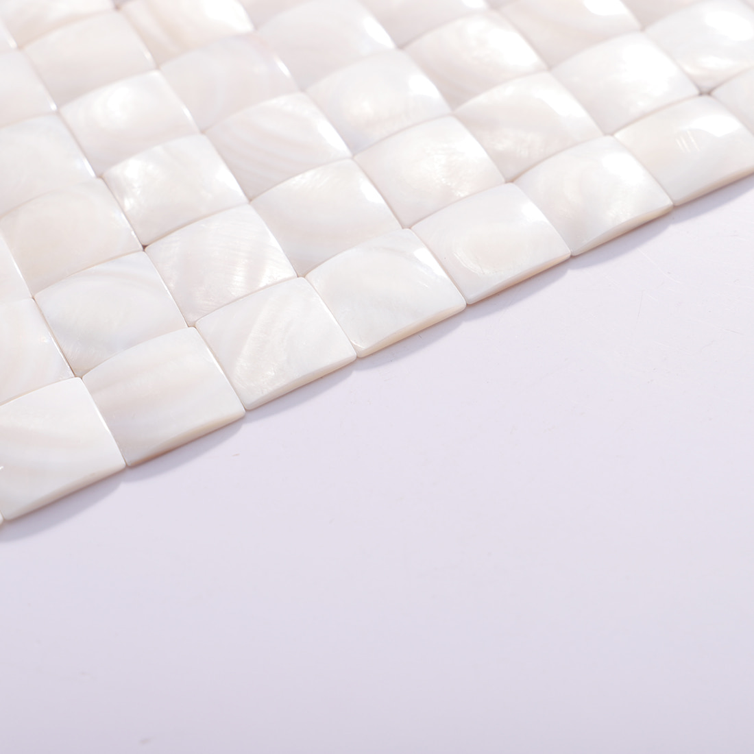 Angled close up showing the edge and surface of the mosaic sheet