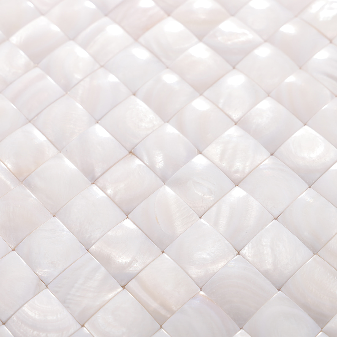 Detailed close up of glossy mother of pearl square mosaic texture