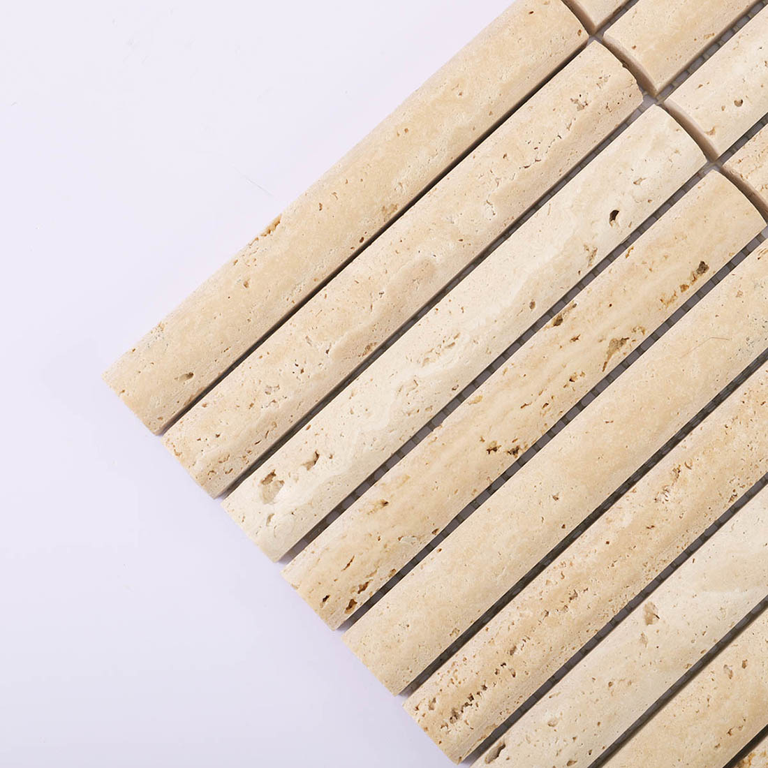 Beige travertine linear mosaic strips showing natural pores and tonal variation