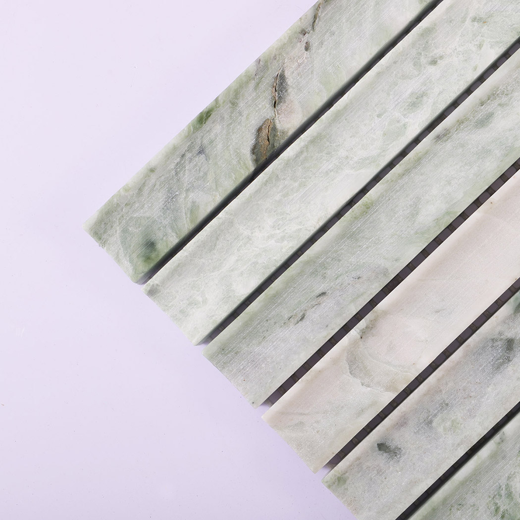 Natural veining detail on pale green marble linear mosaic strips