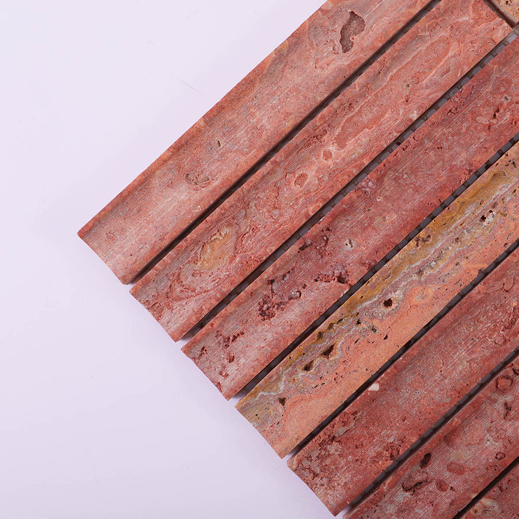 Red travertine linear mosaic strips showing natural pores and warm rust tones