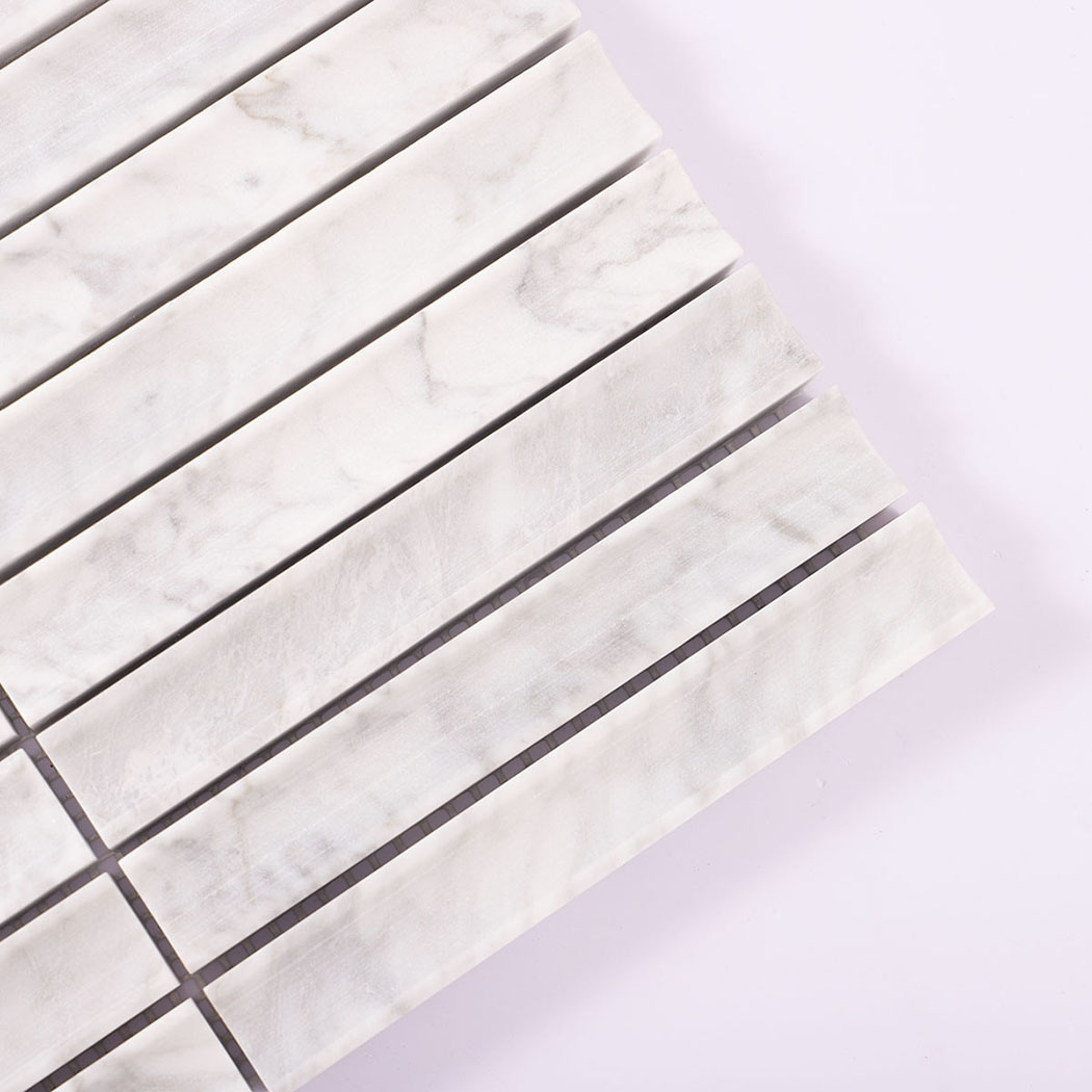 Detail of white marble linear mosaic tiles with subtle gray veining