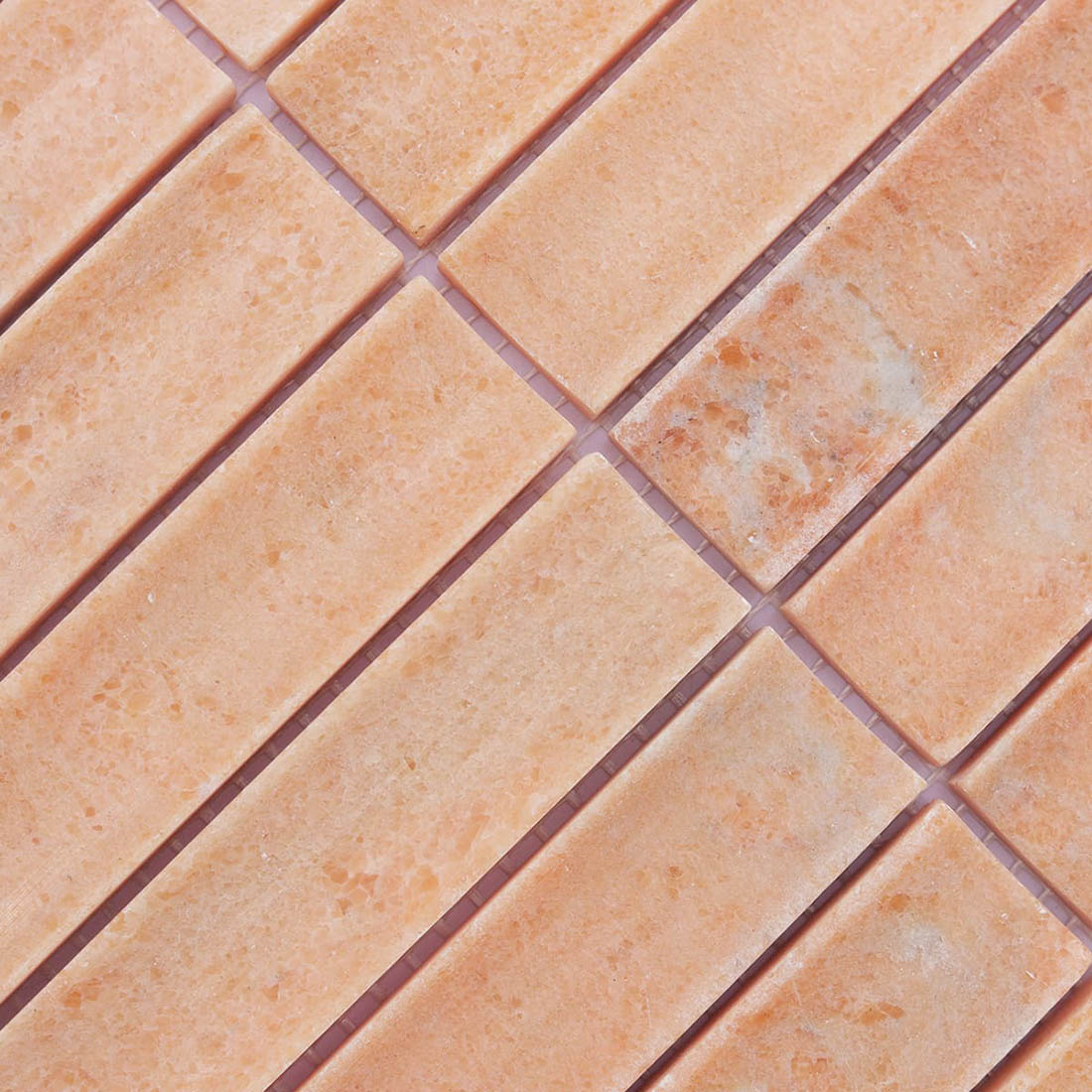 Peach grooved stone mosaic strips with warm tones and natural gray markings