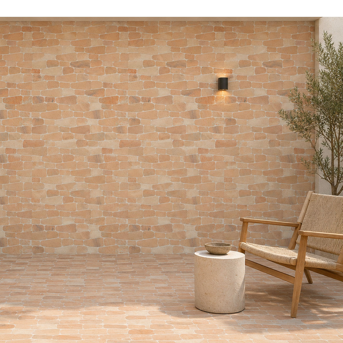 Peach stone mosaic tiles installed on an outdoor patio wall and floor