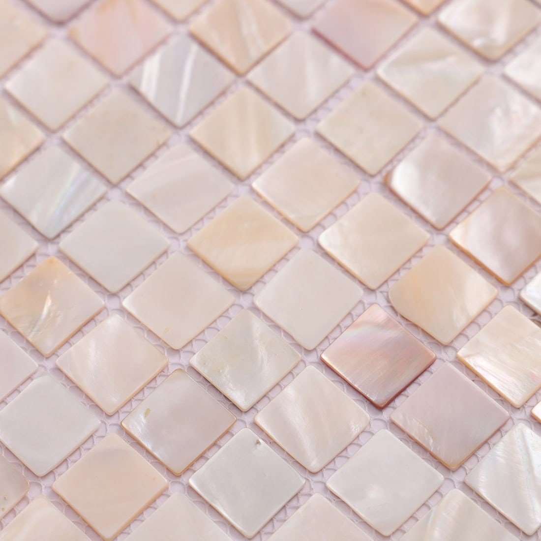 Detailed view of glossy white pearl shell mosaic tile texture