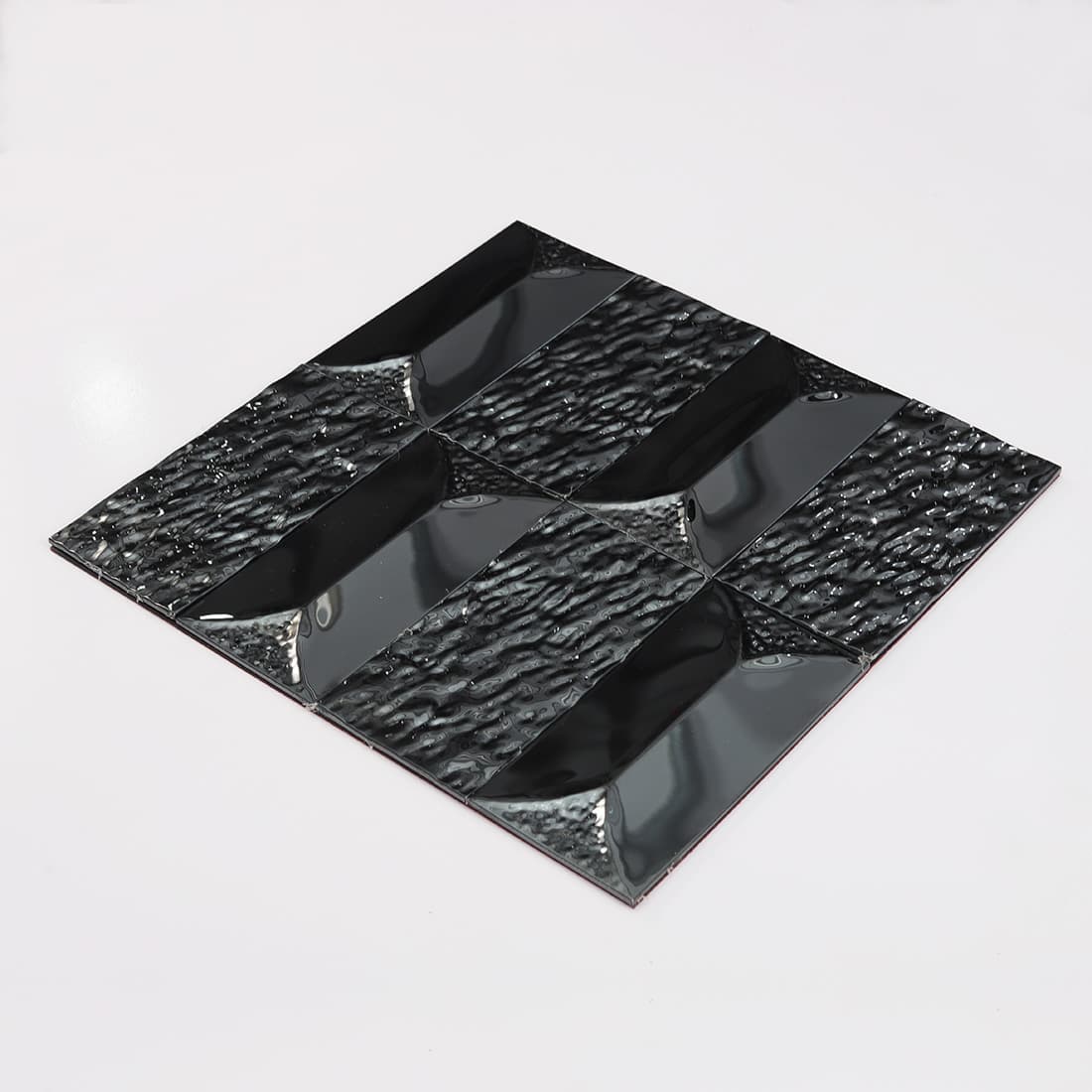 Perspective view of a black stainless steel tile sheet.