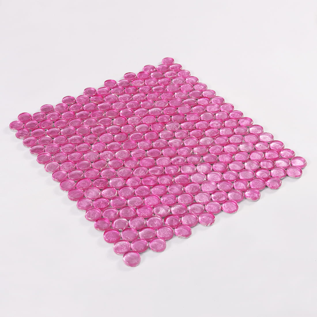 Perspective view of full pink round glass mosaic tile sheet on white background