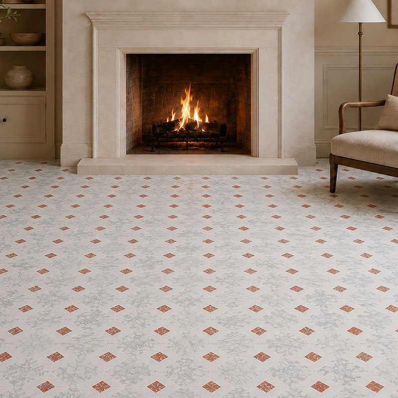 Close view of marble fireplace floor tiles with red inlays before a burning hearth