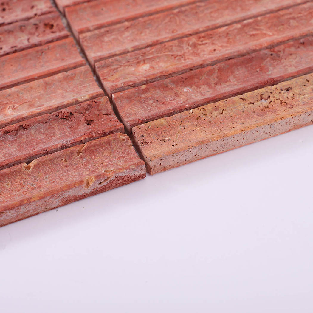 Edge view of red travertine long strip mosaic showing stone thickness and pores