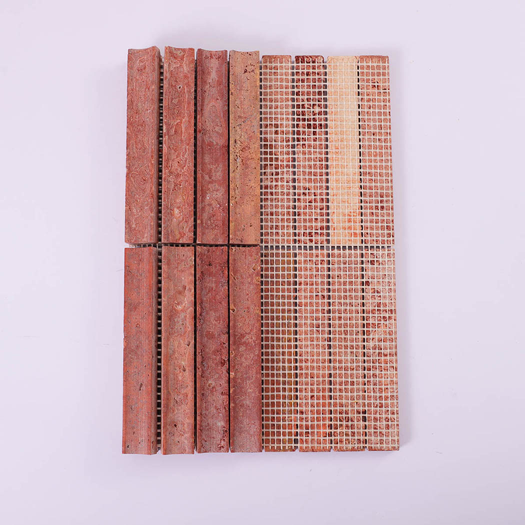 Front and mesh backing view of red travertine vertical strip mosaic tile
