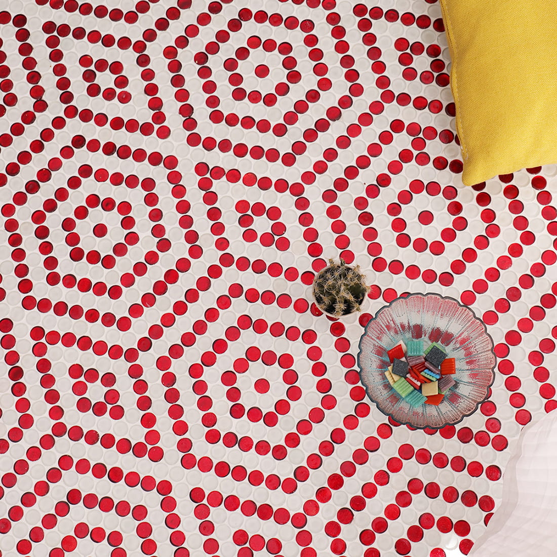 Interior styling scene featuring red penny round glass mosaic floor tiles