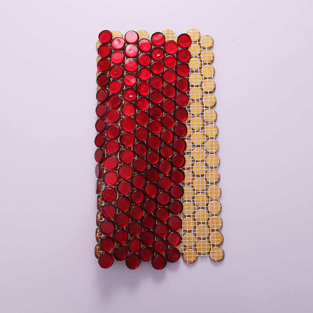 Red round foil glass mosaic tile sheet showing fiberglass mesh backing