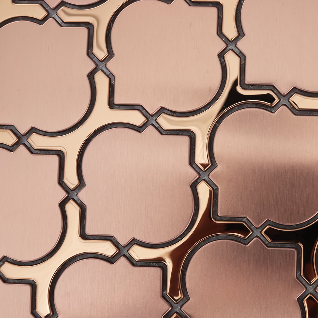 Brushed rose gold lantern mosaic surface with raised glossy metal lines