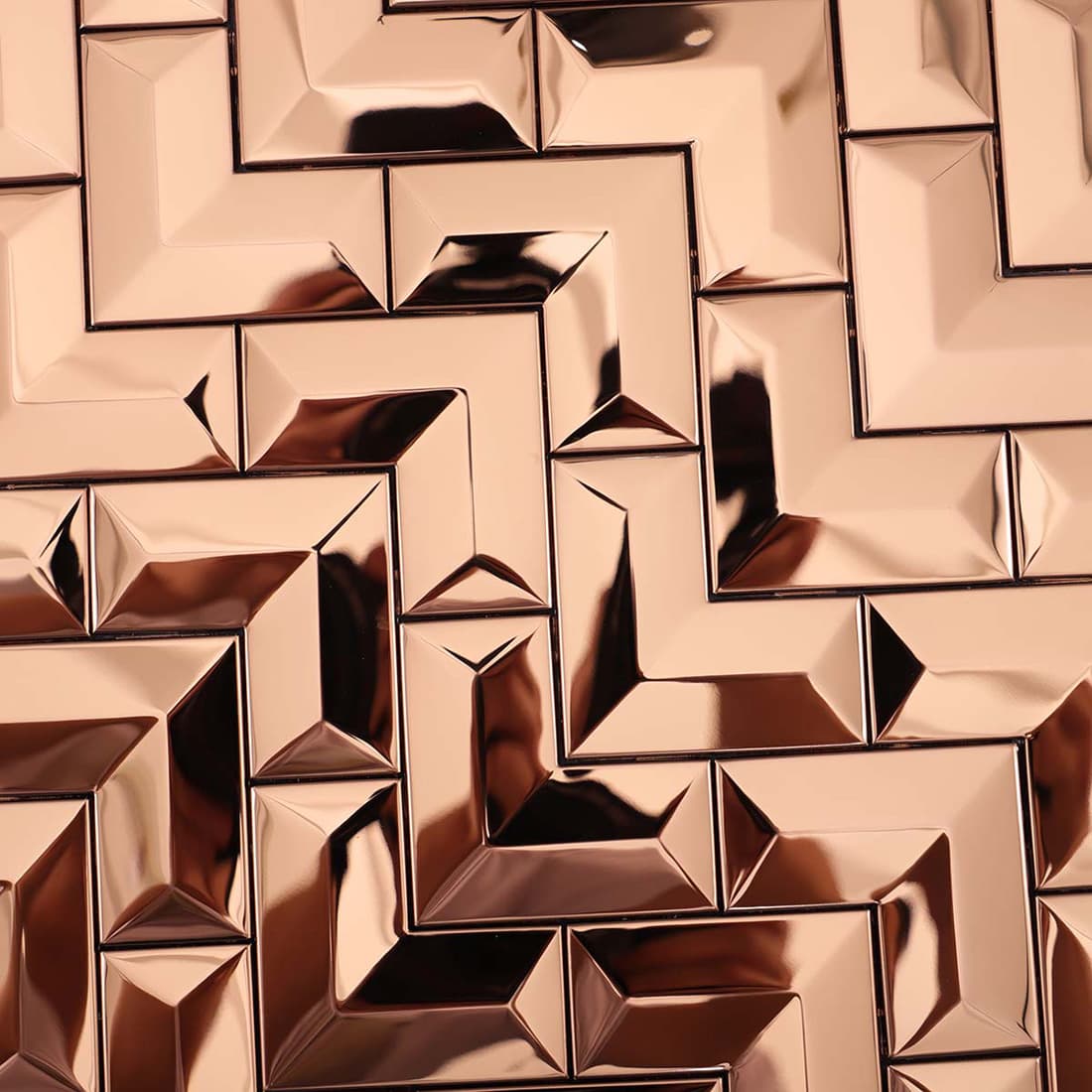 Detailed reflection on the surface of rose gold mirror chevron stainless steel tiles.