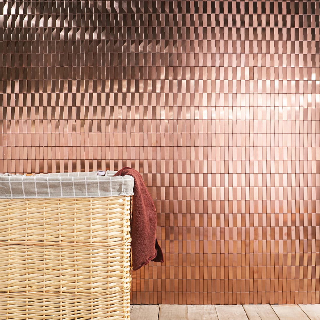 Full bathroom wall featuring rose gold rectangular stainless steel mosaic tiles.