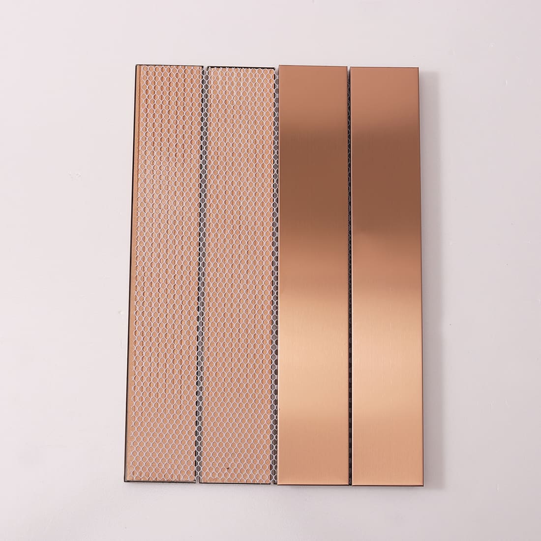 Front and back of rose gold linear tiles showing fiber mesh backing.