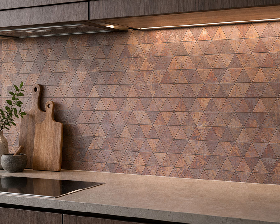 {"default":"Matte bronze triangle tile backsplash with warm kitchen lighting"}
