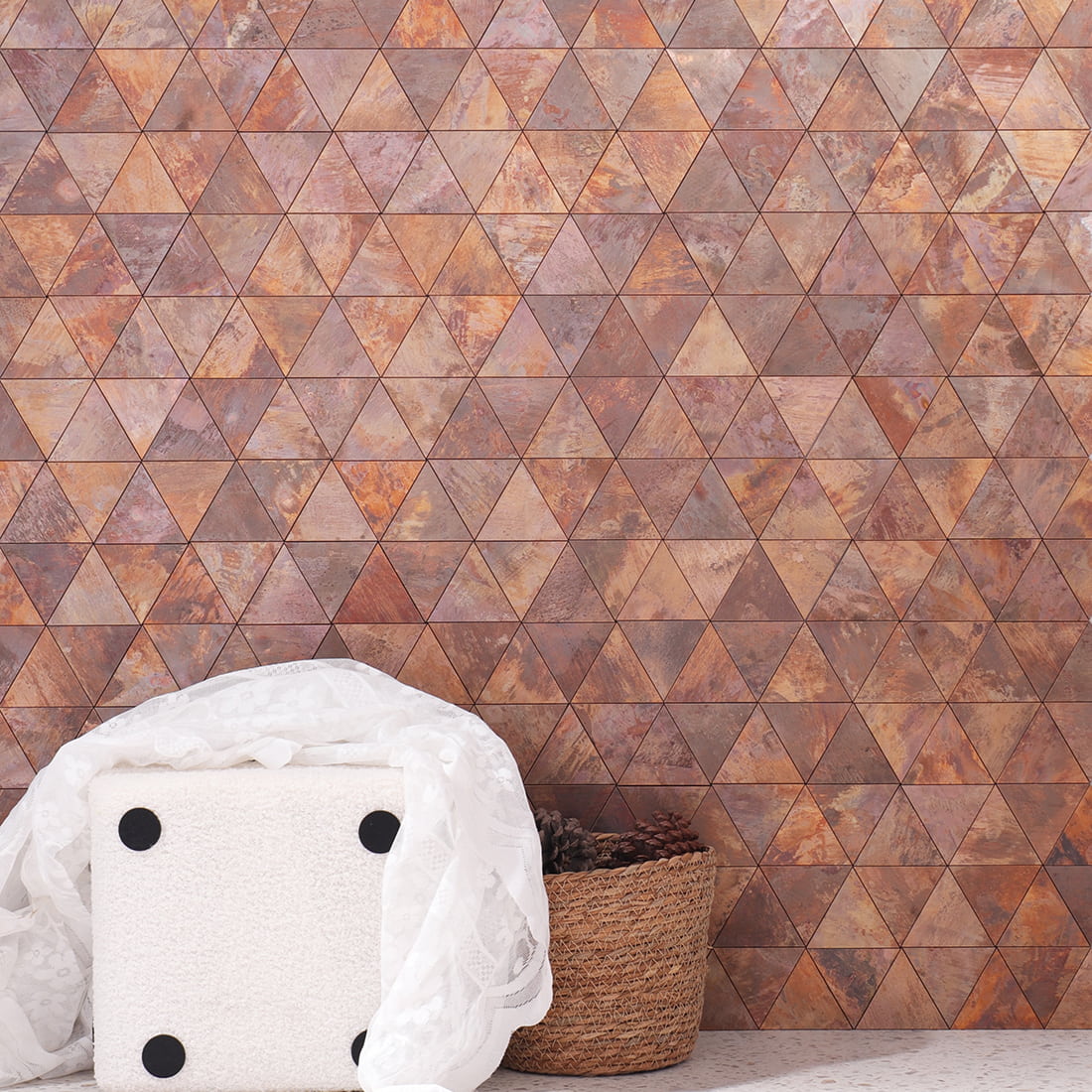 Rustic triangle metal mosaic tile installed as a stylish feature wall.