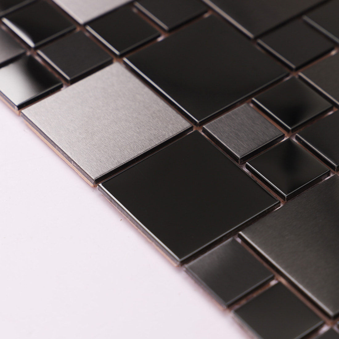 Side angle view of gunmetal stainless steel mosaic showing chip thickness.