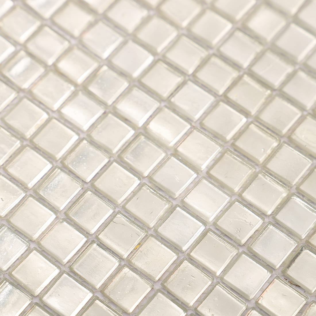Macro shot of silver glass foil mosaic tiles showing foil texture details