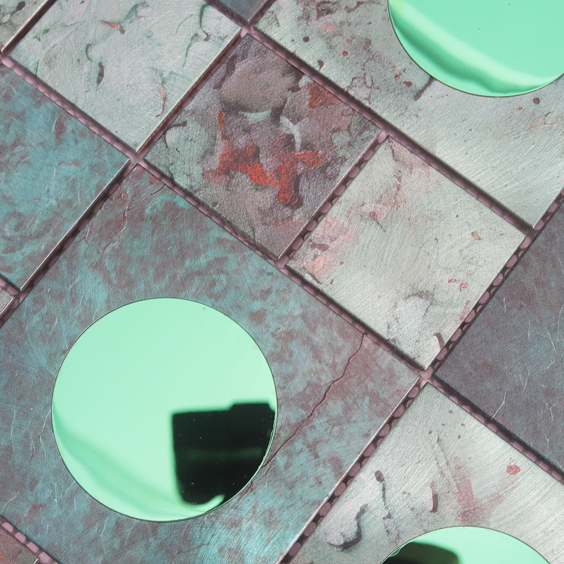 Textured green aluminum mosaic tile with round mirror glass accents