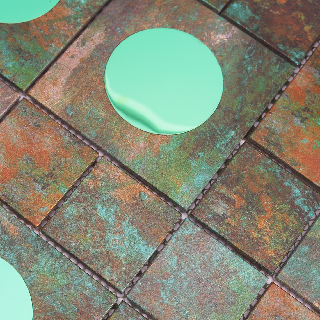 Verdigris aluminum mosaic tile with green circular mirror glass accents