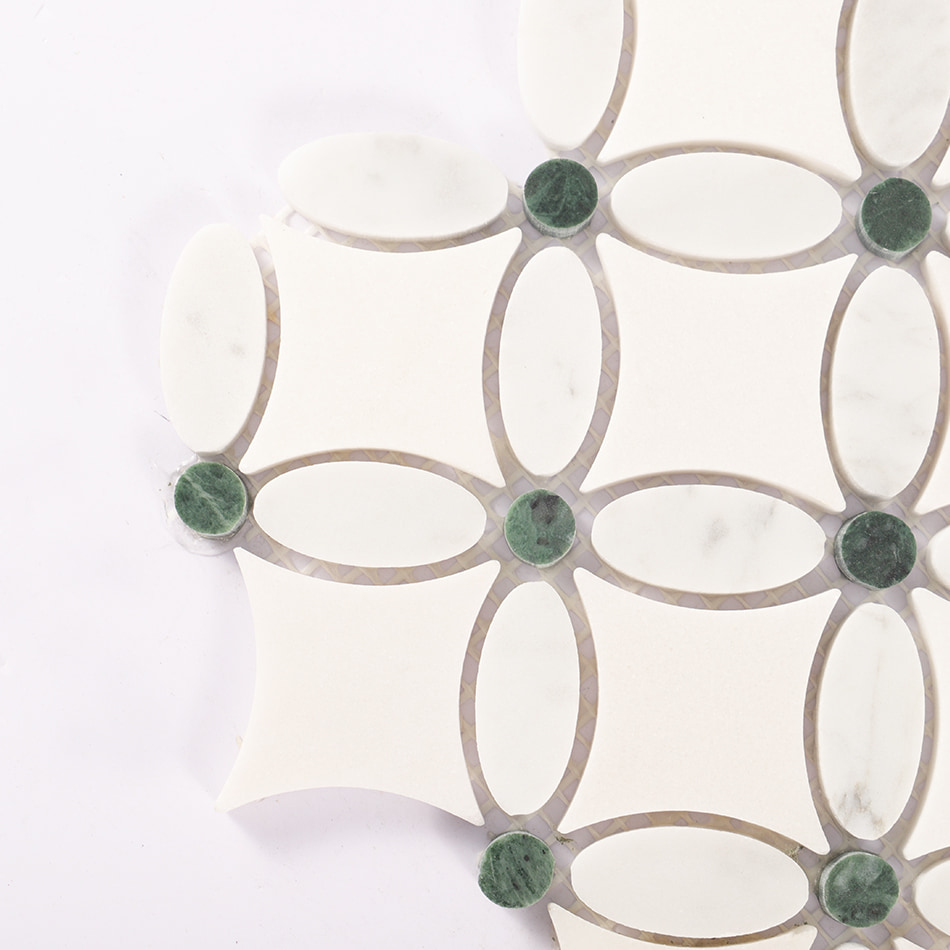 Corner detail of white and green clover marble mosaic tile