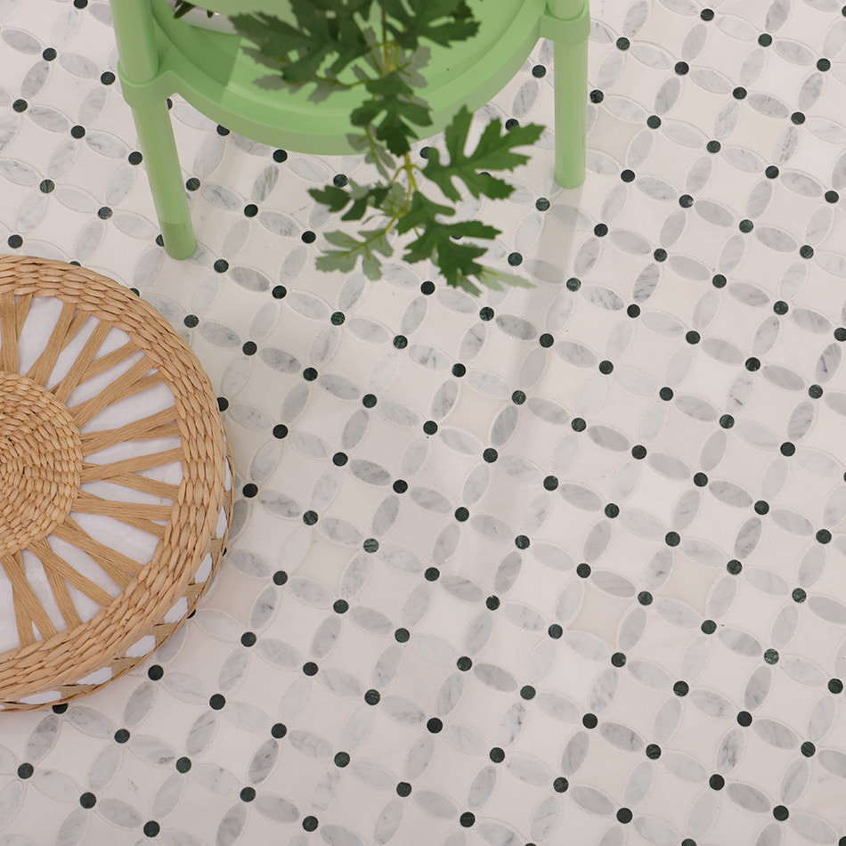Styled floor scene featuring white and green clover marble mosaic tile