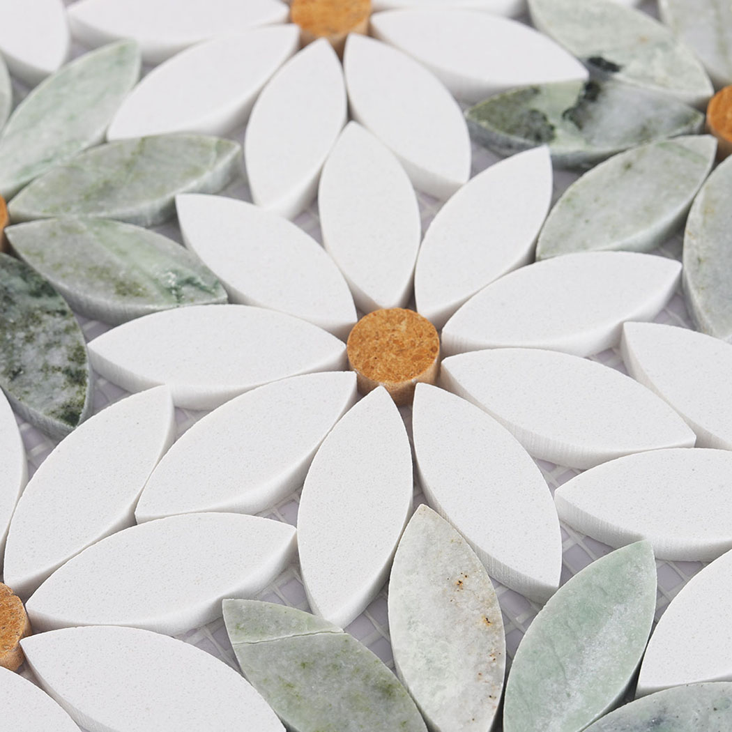 Close detail of white daisy marble mosaic flower with golden round center