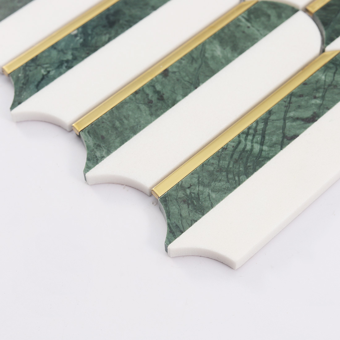 Side view showing thickness of white and dark green marble mosaic with gold trim