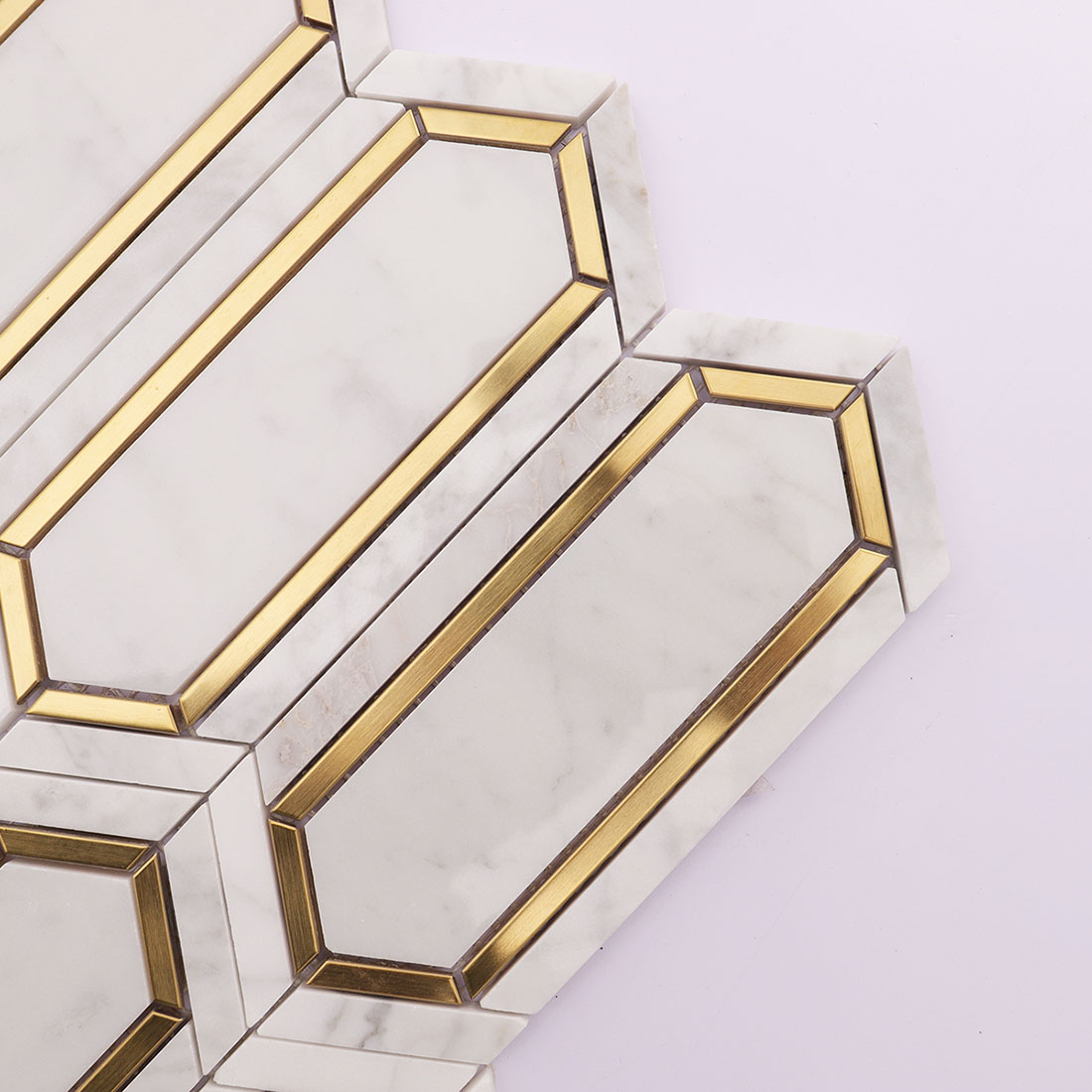 Corner detail of white gold elongated hexagon marble mosaic tile with gold inlay